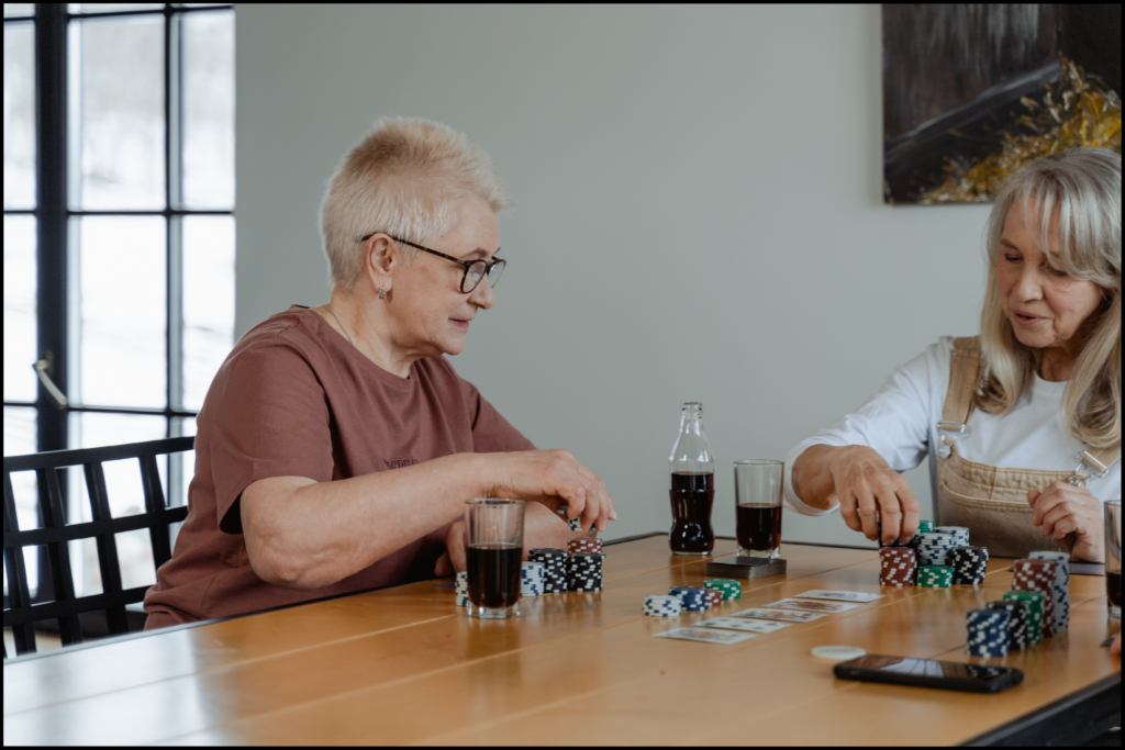 Two women playing a game of cards