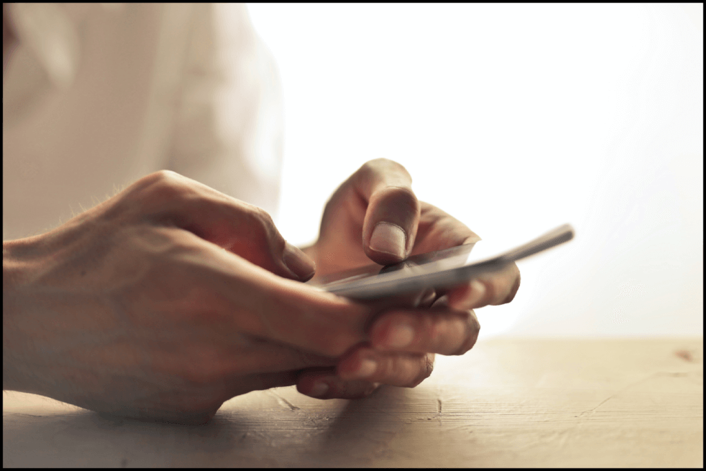 A person holding mobile in his hands and searching